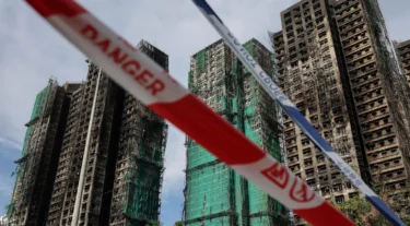 Eight more arrested over fire in Hong Kong that killed at least 128 people