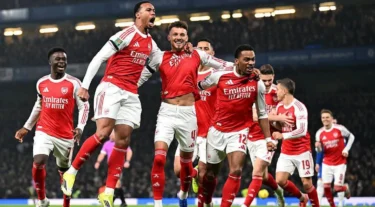 Arsenal players celebrate their goal